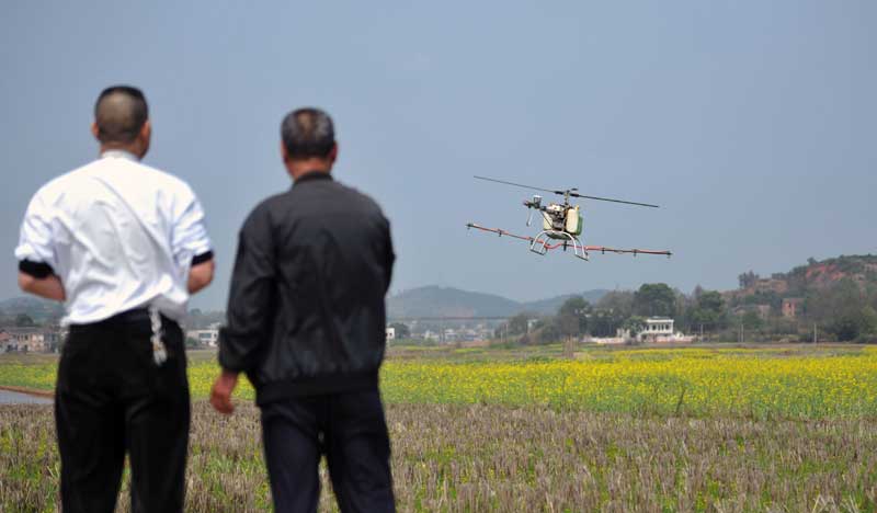 Farmer builds own drones to spray crops