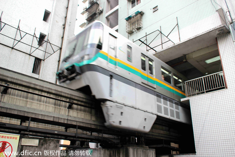 Light rail pass through building in Chongqing