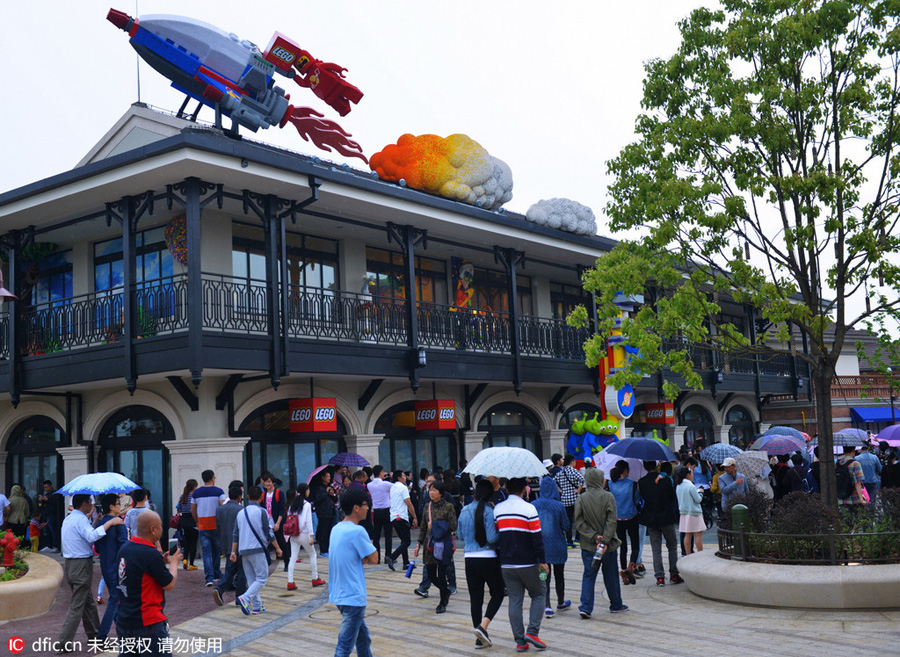 Disney Town staff members greet visitors with smiles