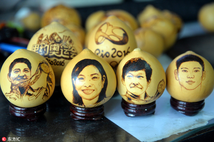 Pyrographs of China's Rio Olympics champions on gourds