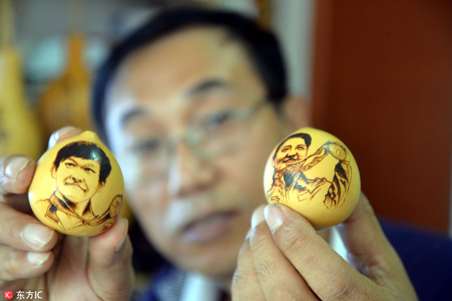 Pyrographs of China's Rio Olympics champions on gourds