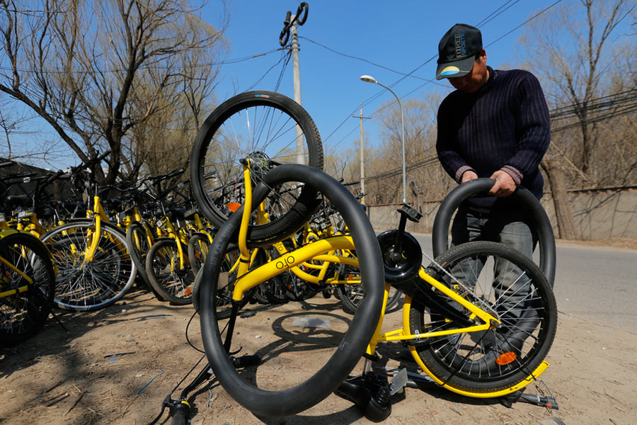 Repairmen race to get shared bikes back on the streets