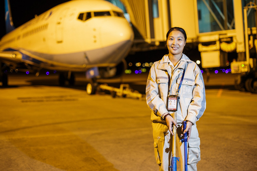 Behind an airport: Obscure people carrying out their duties