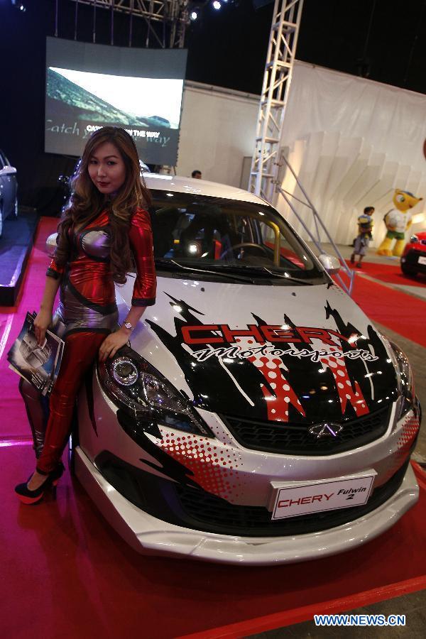 Cars, models at 10th Manila Intl Auto Show