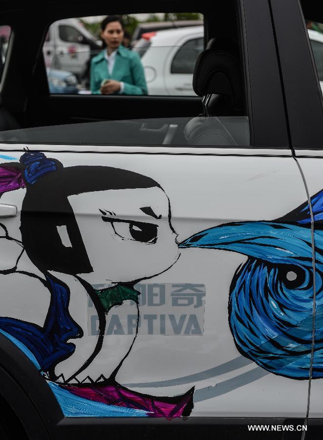 Cars with colorful cartoon drawings parade in Hangzhou