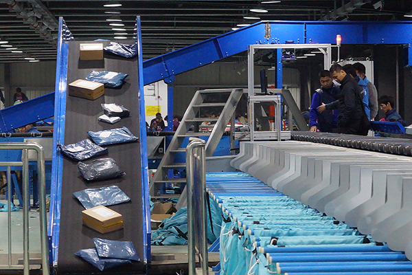 Companies set up robotic package sorting lines