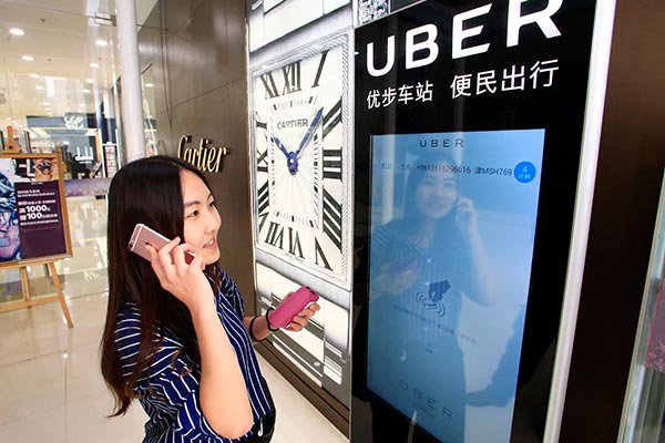 Uber China to shut old app interface, drivers merged
