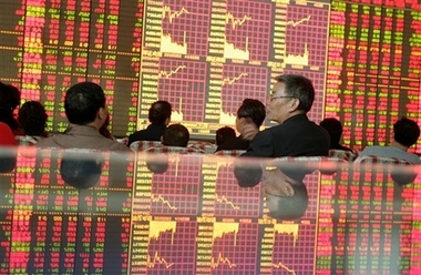 China stocks end 9-day rise in record turnover