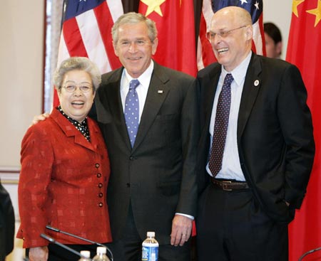 U.S. President George W. Bush (C) and U.S. Secretary of Treasury Henry Paulson (R) welcome Chinese Vice Premier Wu Yi to the Eisenhower Executive Office Building in the White House complex before a meeting of the U.S.-China Strategic Economic Dialogue in Washington, May 24, 2007