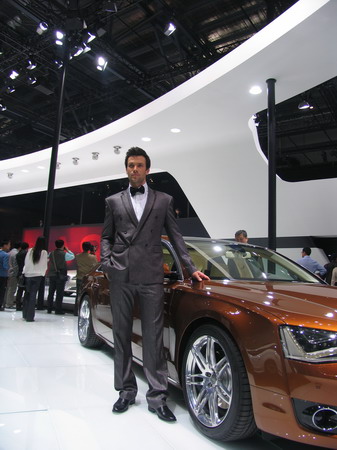 Model poses next to Audi A8L