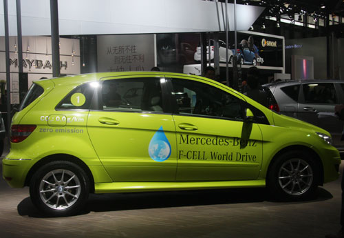 Green cars at the auto show