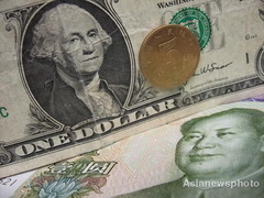 Yuan strengthens after largest one-day fall against US dollar