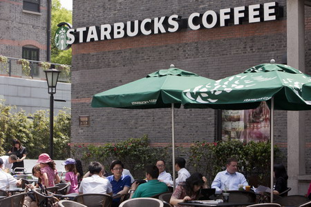 Starbucks buys back control of stores