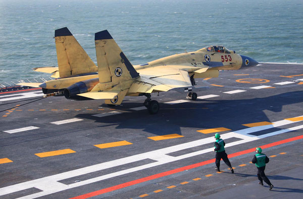 Jets land on China's 1st aircraft carrier