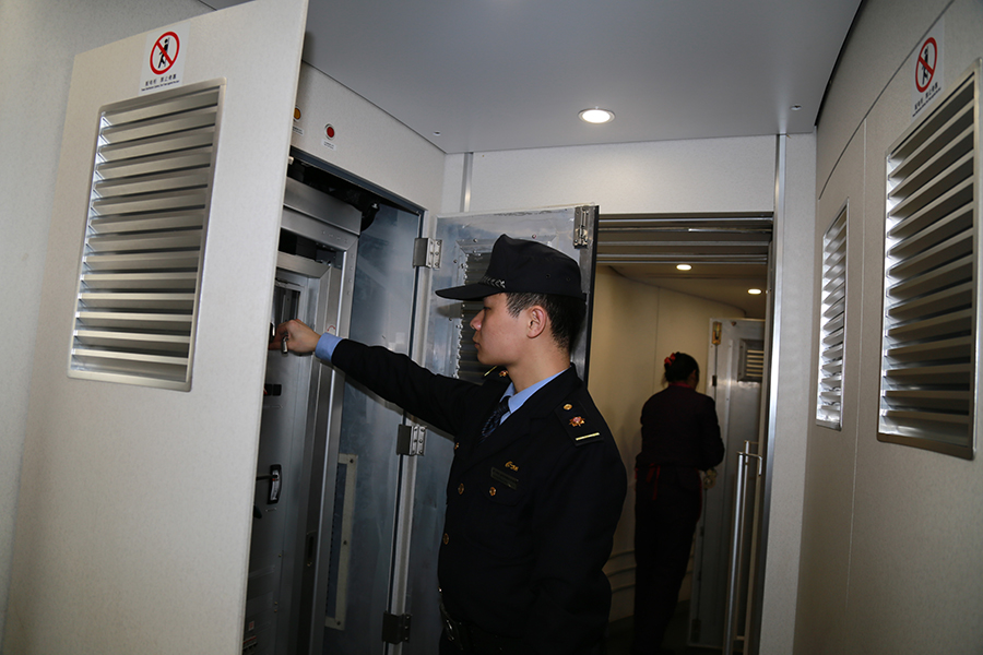 Attendants work in a standby bullet train