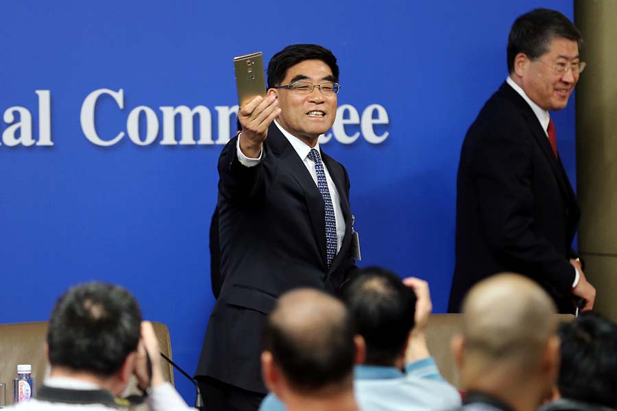 Sinopec's ex-chairman with his Huawei smartphone