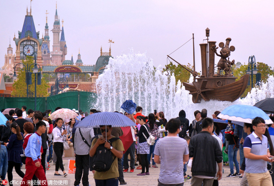 Disney Town staff members greet visitors with smiles