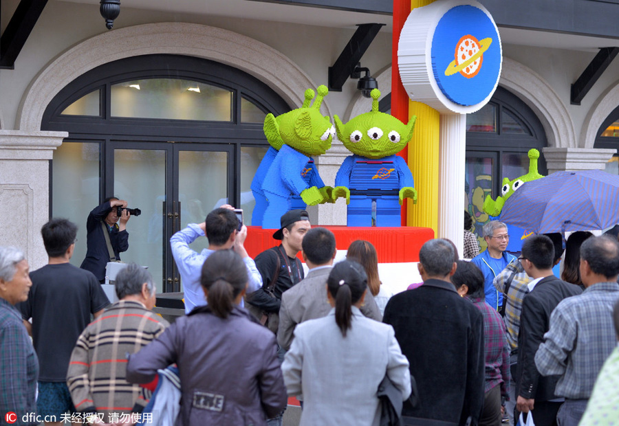 Disney Town staff members greet visitors with smiles