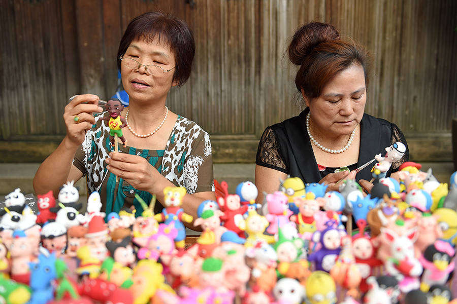 Dough figurine artists create mini Olympic stars