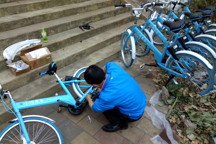 Repairmen race to get shared bikes back on the streets