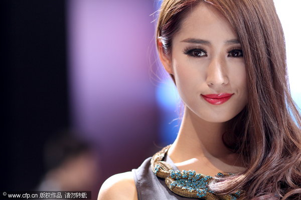 Models take center stage at Auto Shanghai 2013