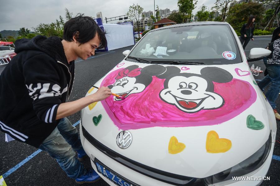 Cars with colorful cartoon drawings parade in Hangzhou