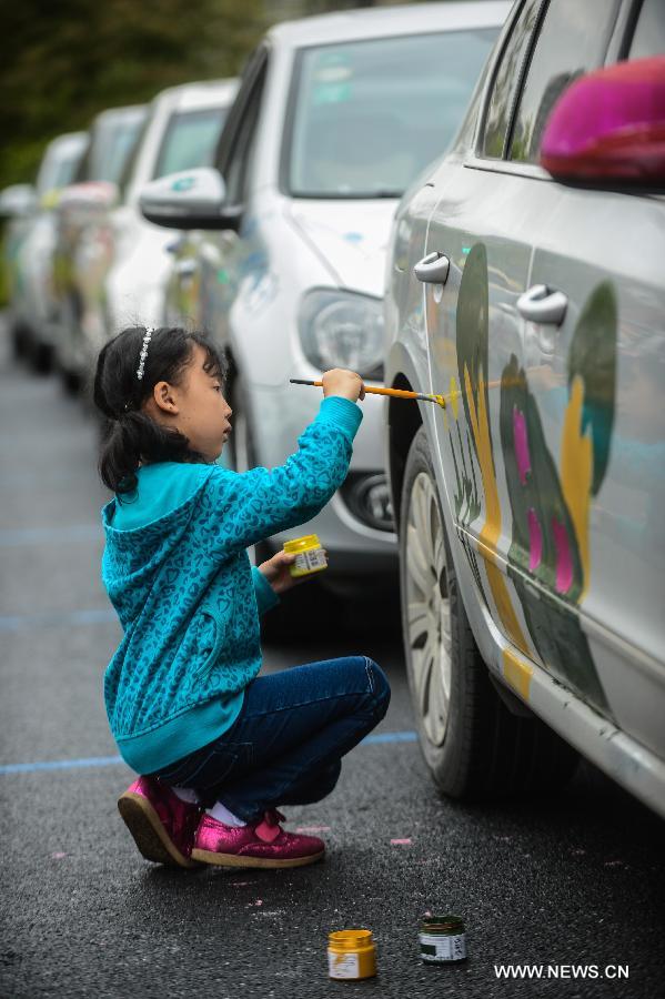 Cars with colorful cartoon drawings parade in Hangzhou