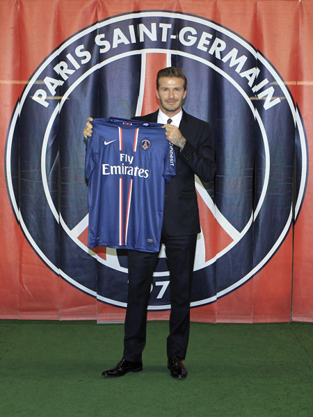 David Beckham arrives for a news conference in Paris