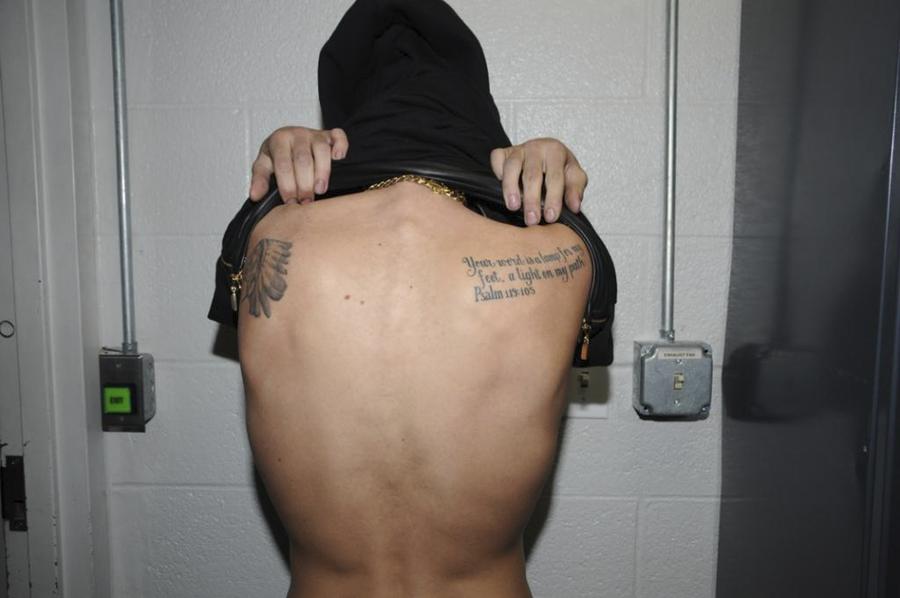 Handout shows Justin Bieber in police custody