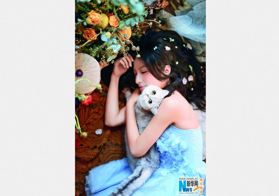 Pan Chen poses for <EM>Cat Fans</EM> magazine