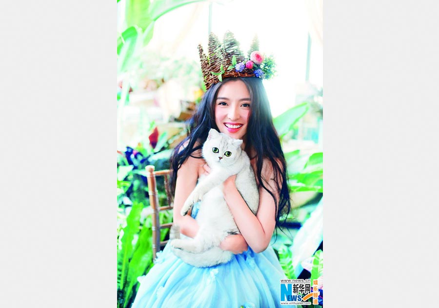 Pan Chen poses for <EM>Cat Fans</EM> magazine