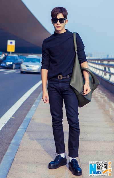 Actor Jing Boran poses in all-black