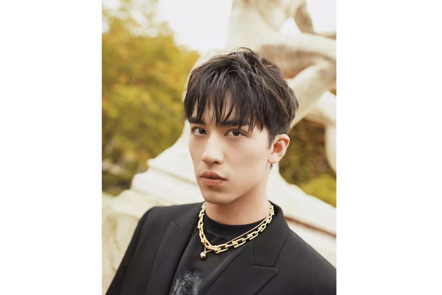 Actor Xu Weizhou poses for fashion magazine