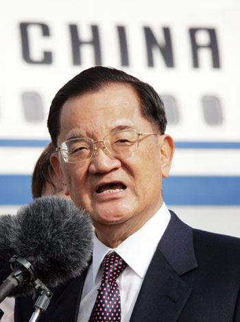 Lien Chan, honorary chairman of Taiwan's main opposition Nationalist Party, delivers a speech upon his arrival at Beijing International Airport April 13, 2006