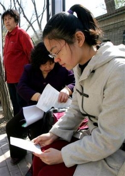 Athena Ren, a 22-year-old student from the Chinese Agricultural University in Beijing who plans to start a five-year degree in animal sciences at New York's Cornell University this fall, waits to apply for her U.S. visa outside of the U.S. embassy visa department in Beijing, China Wednesday April 19, 2006. 