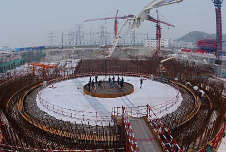 The photo shows the expansion construction site of Qinshan Phase II Nuclear Power Station located in Haiyan County, east China's Zhejiang province, April 28, 2006. China's first self-designed and self-made Qinshan Phase II Nuclear Power Project successfully passed the national acceptance and commenced its expansion project on the day. With a maxium nuclear power generating capacity of 2.6 million kw after the accomplishment of the expansion, Qinshan Phase II nuclear power station, together with Qinshan Phase I and Qinshan Phase III, will play a more and more important role in electric power generation in east China. [Xinhua] 