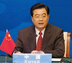 Chinese President Hu Jintao speaks to the media at the Shanghai Cooperation Organisation (SCO) summit in Shanghai June 15, 2006. 