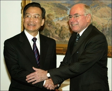 Australian Prime Minister John Howard shakes hands with China's Premier Wen Jiabao during their meeting in Canberra, earlier this year. [AFP]