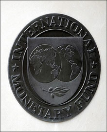 The International Monetary Fund seal is seen in Washington, DC. The US government backs a bigger role at the IMF for China heading into the global body's annual meeting next month in Singapore, an official said.