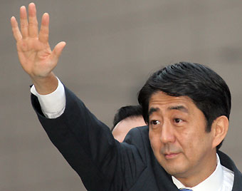 Japan's Chief Cabinet Secretary Shinzo Abe, is expected to become the nation's next prime minister, raises his arm during a campaign tour for leadership of the ruling Liberal Democratic Party in Atsugi, west of Tokyo September 14, 2006. 