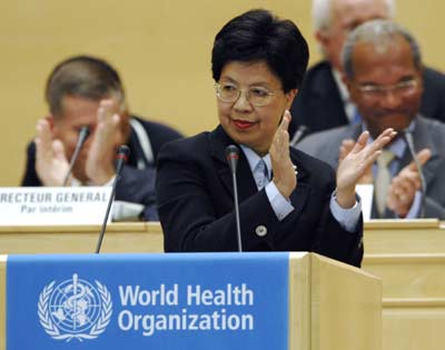 Newly elected World Health Organisation (WHO) Director-General Margaret Chan of China applauds during a special session of the World Health Assembly in Geneva November 9, 2006. Chan, the first Chinese national to head a major U.N. agency, was nominated on Wednesday by the WHO's executive board to succeed the late Lee Jong-wook as director-general.