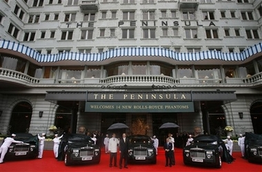 Ian Robertson, chairman of Rolls-Royce, front left, and Michael Kadoorie, chairman of the Hong Kong and Shanghai hotels limited attend the unveiling ceremony of the new fleet of Rolls-Royce Phantoms at the Peninsula hotel in Hong Kong Thursday, Dec. 14, 2006. The Peninsula Hotel takes delivery of the largest ever single order of new Rolls-Royce Phantoms with 14 extended wheelbase cars, all finished in signature Peninsula Green.(AP