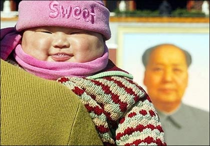 A chubby baby smiling in front of the portrait of former Chinese leader Mao Zedong at Tiananmen Square in Beijing, in 2002. China as a nation has grown in stature since unleashing its economy more than two decades ago but so have its people, who are getting taller and heavier, state media reported.(AFP
