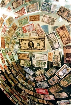 Foreign currencies displayed on a glass panel at a money-changer booth. Investors and banks pumped half-a-trillion dollars into emerging markets in 2006, with China and other Asian economies accounting for the lion's share of such money flows, the Institute of International Finance said.[AFP]