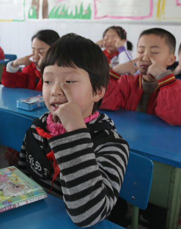 Girl resumes school with one arm