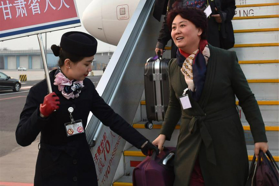 Deputies to 12th NPC arrive in Beijing