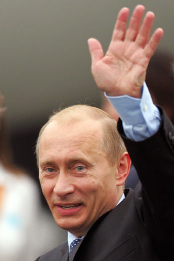 Russian President Vladimir Putin arrives at the Pudong Airport in Shanghai to attend the Shanghai Cooperation Organization (SCO) summit which starts today June 14, 2006. 