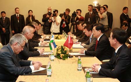 Hu meets with Uzbekistani president