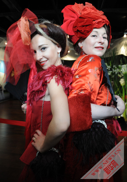 Bold scarlet , wild Versailles roses highlight in French Pavilion