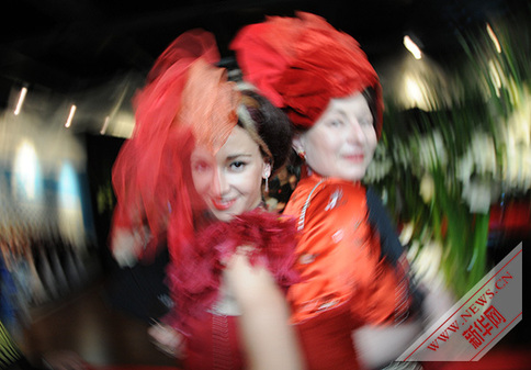 Bold scarlet , wild Versailles roses highlight in French Pavilion